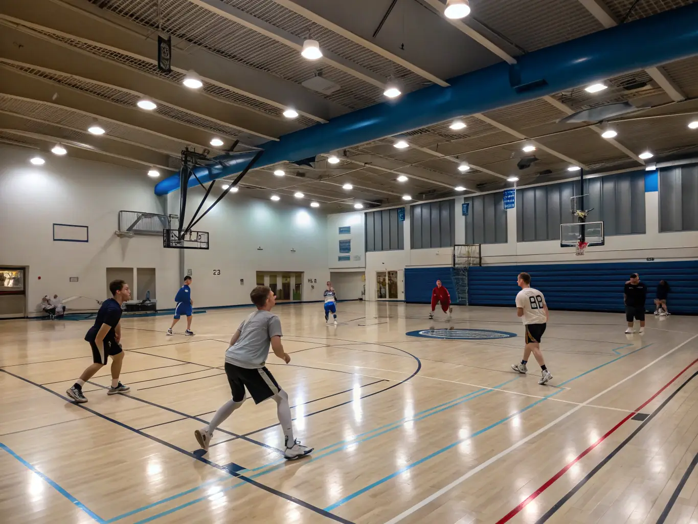 A photograph of students participating in a basketball clinic, focusing on skill development and teamwork.